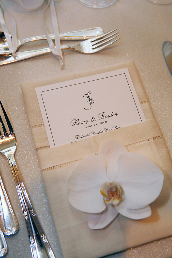 Ivory place card with ribbons and white orchid - wedding photo by Merri Cyr
